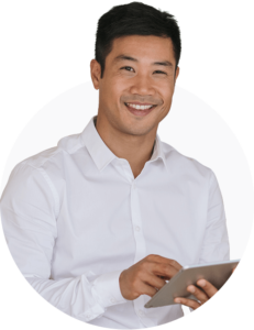 A professional looking man smiling at the camera with a tablet in his hands.